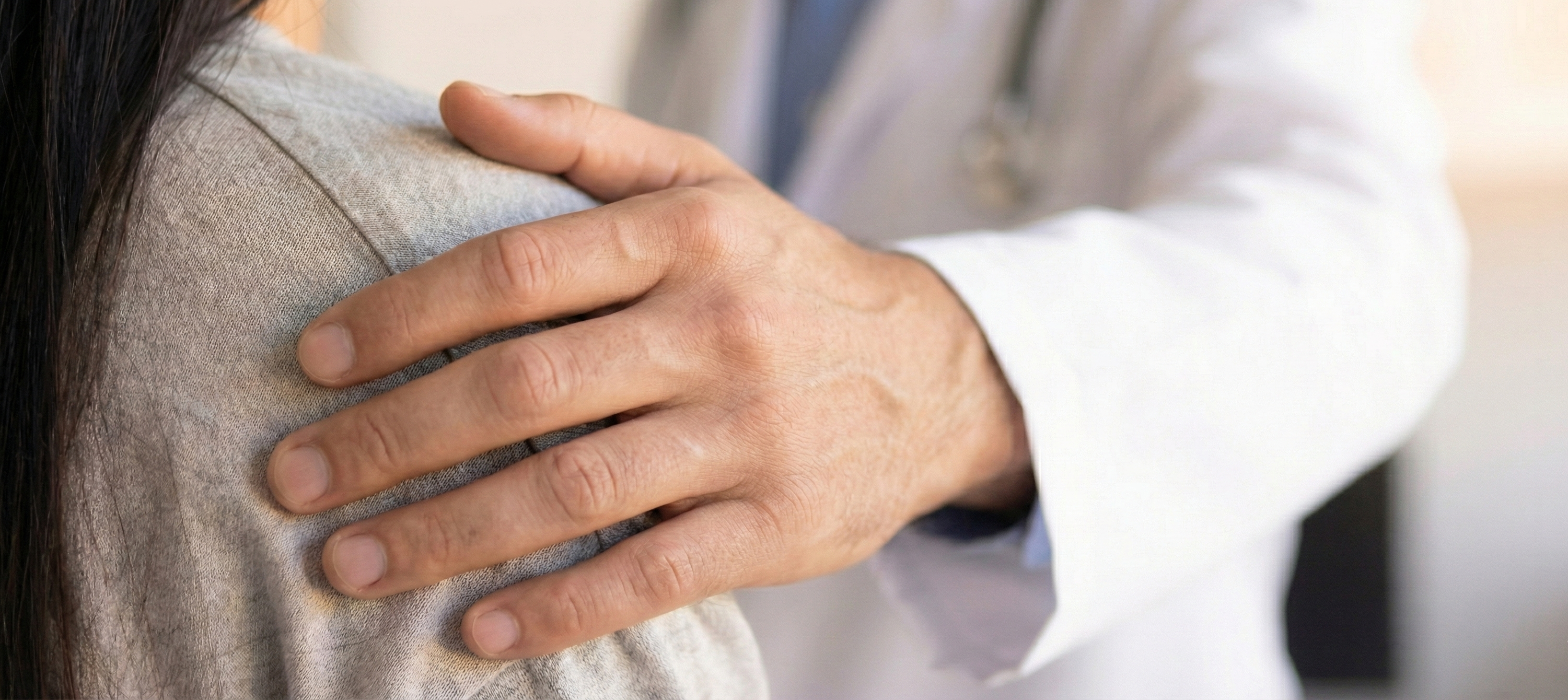 Caring doctor with patient